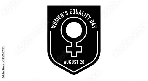 Women_s equality day logo on a black shield with a female symbol.