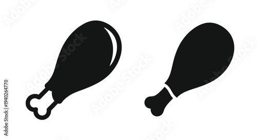 Two black chicken drumsticks depicted in a striking silhouette