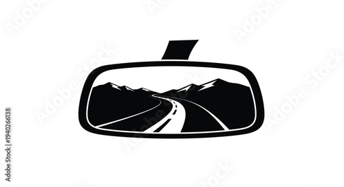 Mountain road view reflected in a car s rearview mirror silhouette