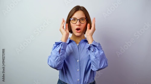 Happy girl trying on glasses for vision very happy that now she sees clearly joyful girl putting on eyeglasses successful purchase good choice excellent vision surprise and joy positive emotions