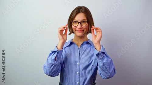 Beautiful girl in glasses rejoicing good vision happy young woman celebrating clear sight with eyewear successful purchase joy triumph positive emotions cheerful studio portrait