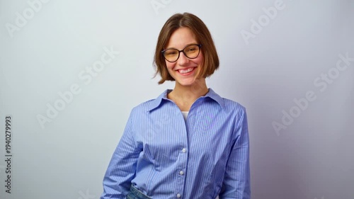Pretty girl joy putting on glasses for vision happy young woman trying eyeglasses joy clear sight success good purchase positive emotions smiling cheerful studio