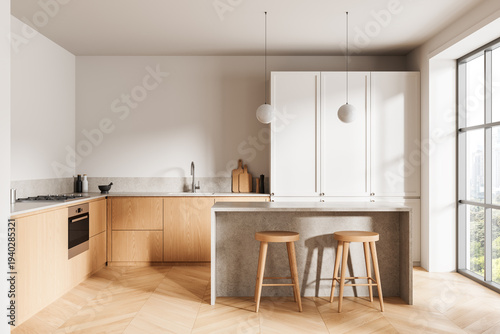 Bright modern kitchen interior with wooden cabinets, island counter, stools, soft lighting and large window creating warm minimalist design concept. 3D Rendering