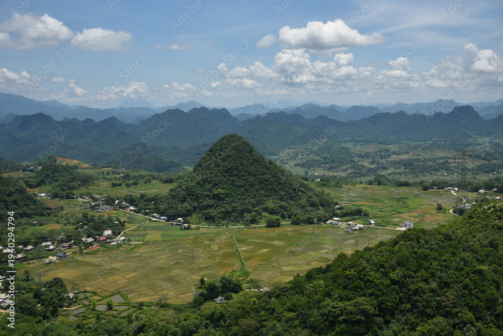 Fototapeta premium Panoramic Mountain Valley with Rice Fields and Karst Hills in Northern Vietnam