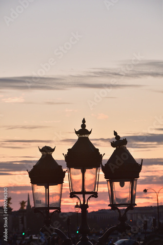 Photography Silhouette of a Paris street lamp against sunset sky at dusk in Paris France, Ma
