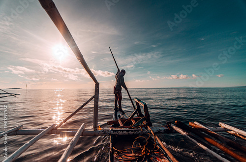 Canvas Print Boatman in Camiguin, Philippines.