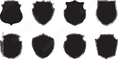 Eight black silhouette badge shapes with rough edges for emblems logos and shields in vintage retro style on transparent background