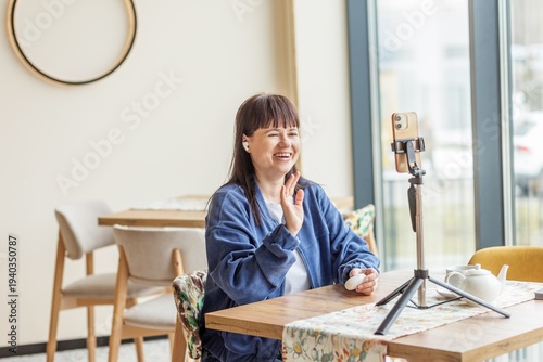 Woman Recording Video Call on Smartphone Tripod