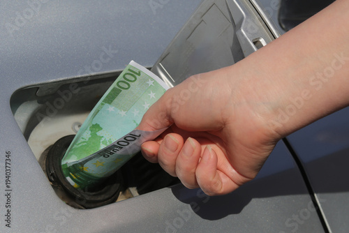 People pay for fuel amid rising gas prices and increased demand at gas stations in urban areas