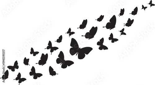 Flock of black butterflies flying in a diagonal line