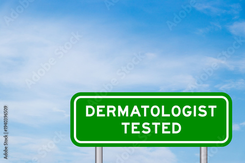 Green color transportation sign with word dermatologist tested on blue sky with white cloud background
