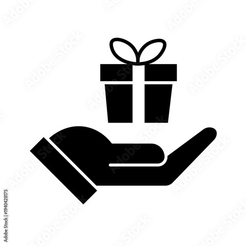 Vector art illustration of a hand holding a neatly wrapped gift box with a red bow on top. Hand gift con vector silhouette on white background. Silhouette of a hand holding a gift box with ribbon.
