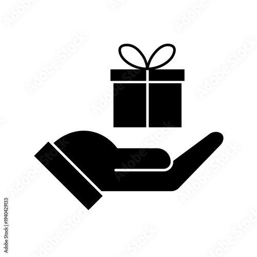 Vector art illustration of a hand holding a neatly wrapped gift box with a red bow on top. Hand gift con vector silhouette on white background. Silhouette of a hand holding a gift box with ribbon.