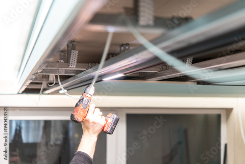 Installing suspended ceiling with lighting rail and LED fixtures