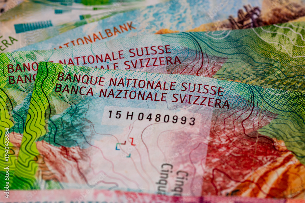 Naklejka premium Detail of Swiss Franc banknotes representing economy and inflation in Switzerland