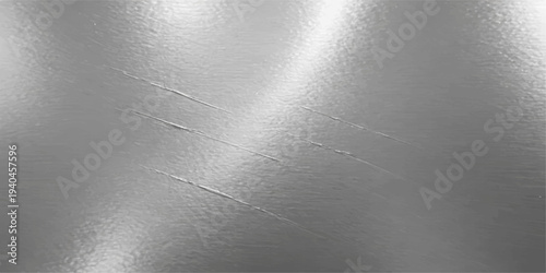 A polished stainless steel plate featuring a brushed metallic texture with a silver aluminum surface pattern and light grey reflections on a shiny material sheet