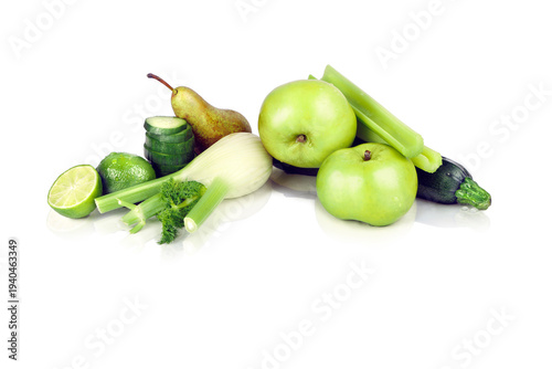 Assortment of Green Fruits and Vegetables Including Apples, Pears, Cucumber and Courgette on White Background