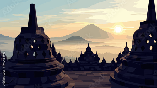 Scenic sunrise at borobudur temple with misty volcano in the background