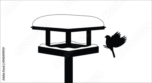 A black bird approaches a bird feeder simple vector silhouette