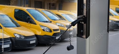 Wallpaper Mural Electric delivery vans with electric vehicles charging station Torontodigital.ca