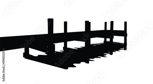 A dark pier extends into water creating a striking silhouette