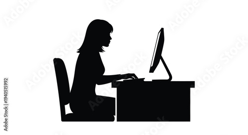 Woman working at a desk with a computer a striking silhouette