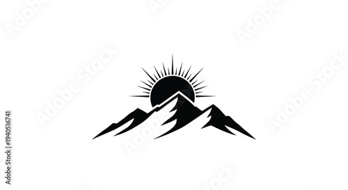 Mountain range with a rising sun a striking black silhouette