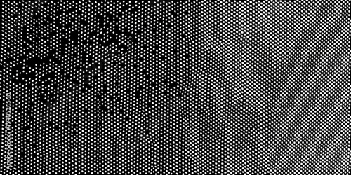 Abstract black and white halftone pattern with grainy texture
