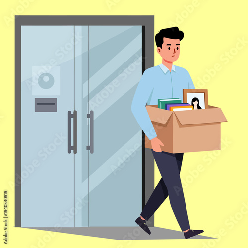 Young man in blue shirt carrying a brown cardboard box with personal items, walking.