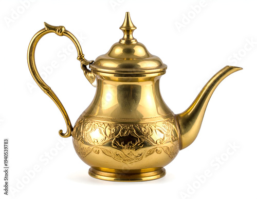 Ornate gilded metal teapot with intricate etched floral designs