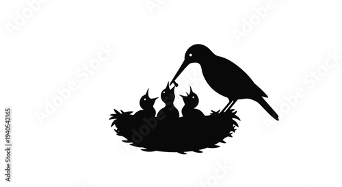 Mother bird feeding her chicks in the nest.