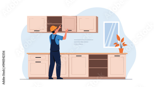 Professional carpenter installing kitchen cabinets and cupboards in domestic home interior during renovation and remodeling project.