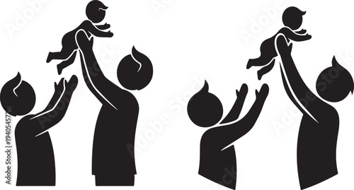 Silhouetted family playfully lifting baby in joyful moment together