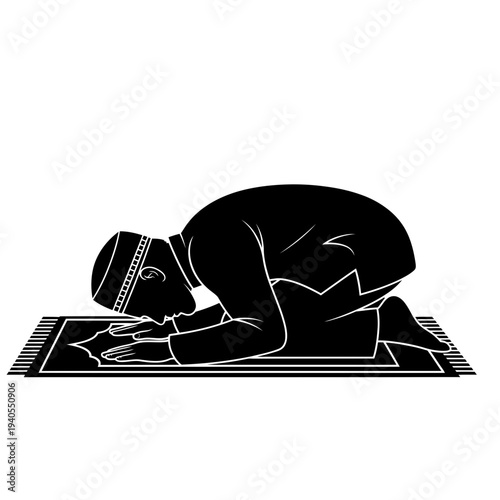 Man praying on prayer mat in peaceful meditation