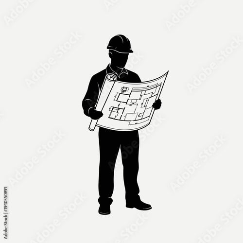 Construction worker reviewing building plans on site