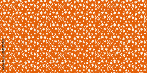 Bright orange background filled with a dense pattern of small white stars