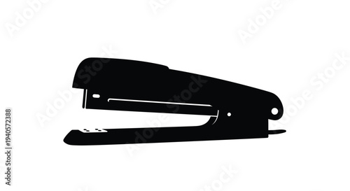A black silhouette of a standard office stapler on white background
