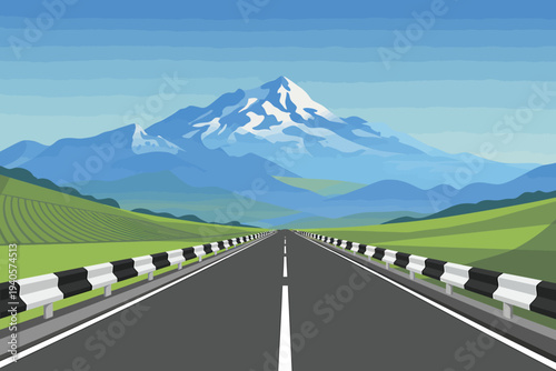 Asphalt road stretching to snow capped mountain in distance through green hills