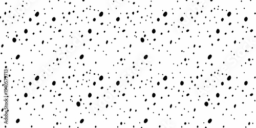 Abstract pattern of scattered irregular black shapes on a white background