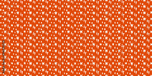 Abstract orange background with scattered white star like shapes