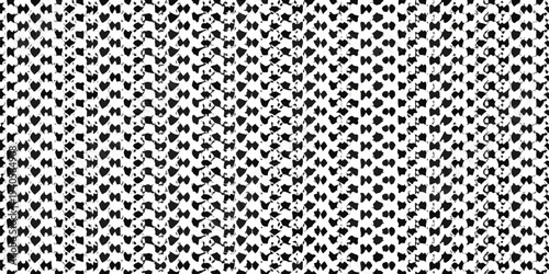 Dense pattern of abstract heart shapes in black and white