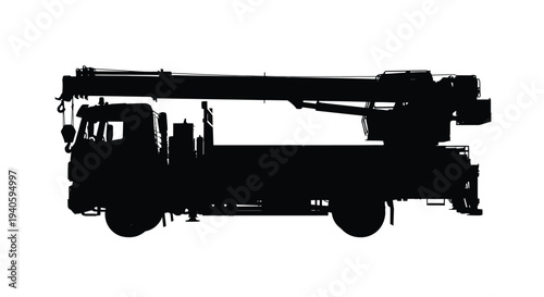 A stark silhouette of a heavy duty crane truck is presented against a bright white background emphasizing its mechanical form