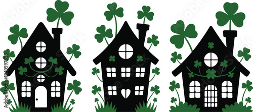Three black silhouette houses decorated with shamrocks for st patrick s day