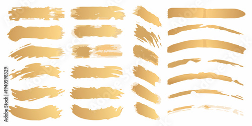 Collection of abstract golden brush strokes and textured shapes