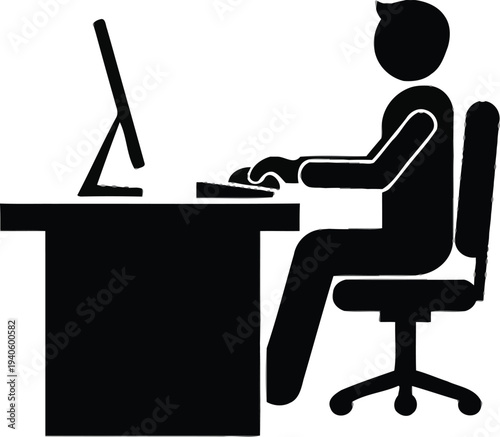 Office worker sits at a desk interacting with a desktop computer monitor and keyboard, representing typical office work tasks.