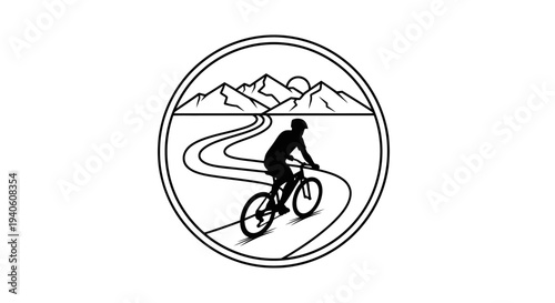 Cyclist riding on a winding road through mountains.
