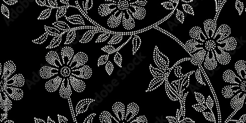 Delicate floral pattern created with tiny white dots on black
