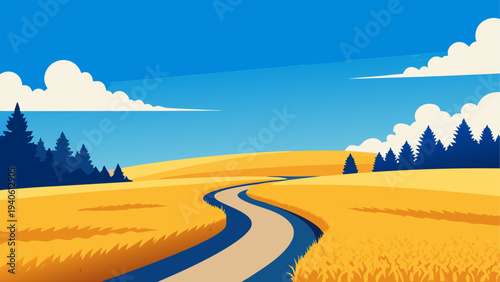 Winding road through golden field landscape