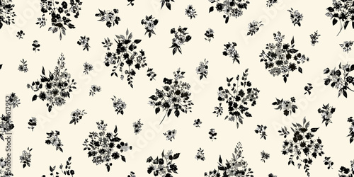 Delicate black floral pattern on a cream colored background