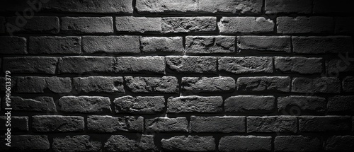 Dark and Grungy Brick Wall Texture with Dramatic Lighting.